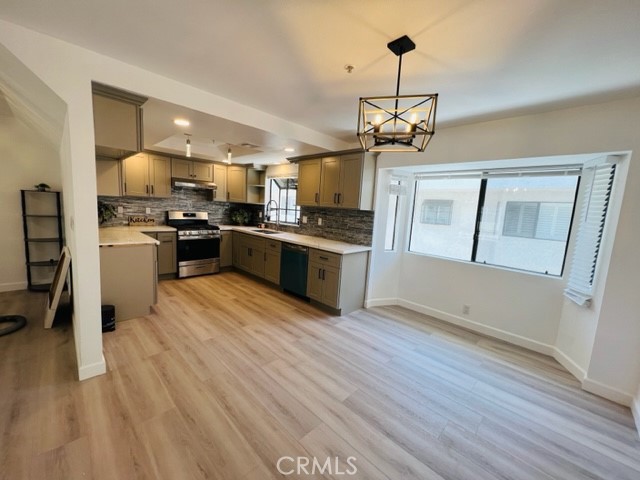 517 North Curtis Avenue, Unit E Alhambra, CA 91801 - Photo 14 of 34 a kitchen with stainless steel appliances granite countertop a stove and refrigerator