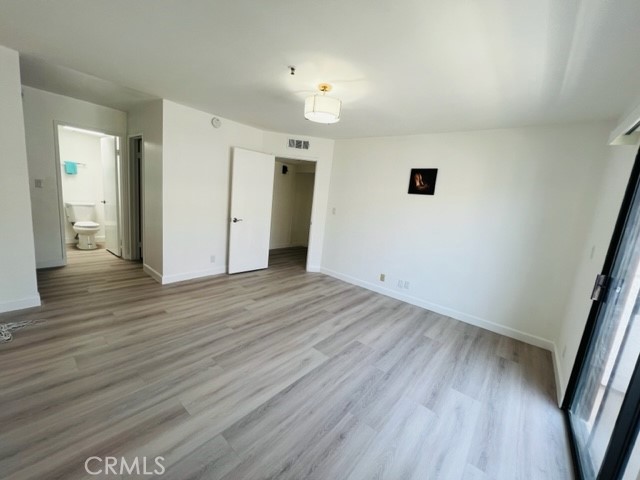 517 North Curtis Avenue, Unit E Alhambra, CA 91801 - Photo 16 of 34 wooden floor in an empty room with a window