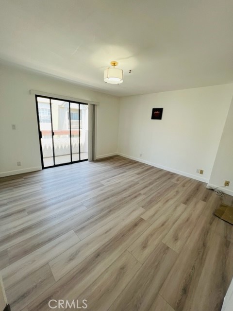 517 North Curtis Avenue, Unit E Alhambra, CA 91801 - Photo 20 of 34 wooden floor in an empty room with a window