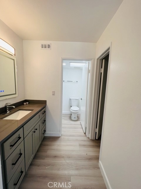 517 North Curtis Avenue, Unit E Alhambra, CA 91801 - Photo 21 of 34 a spacious bathroom with a granite countertop sink and a mirror
