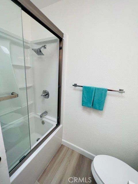 517 North Curtis Avenue, Unit E Alhambra, CA 91801 - Photo 25 of 34 a bathroom with a toilet and a shower