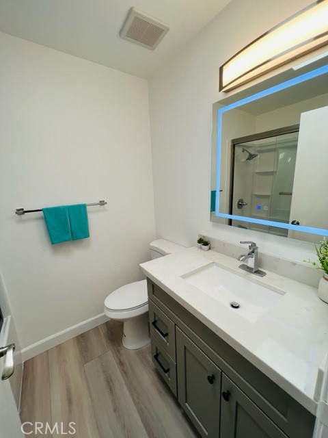 517 North Curtis Avenue, Unit E Alhambra, CA 91801 - Photo 26 of 34 a bathroom with a sink a toilet and mirror