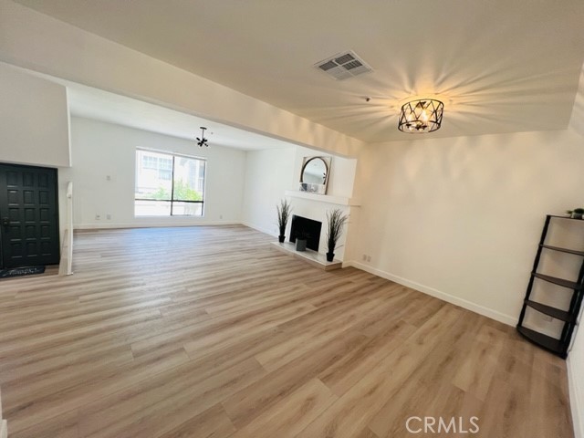 517 North Curtis Avenue, Unit E Alhambra, CA 91801 - Photo 7 of 34 wooden floor in an empty room with a window