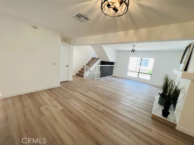 517 North Curtis Avenue, Unit E Alhambra, CA 91801 - Photo 8 of 34 a view of empty room with wooden floor