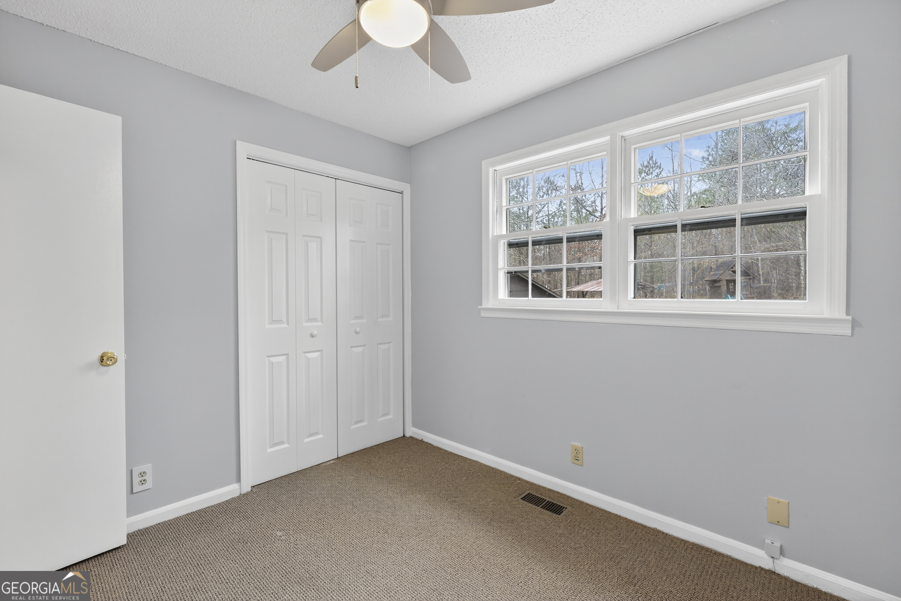 149 Forest Hill Road Southwest Milledgeville, GA 31061 - Photo 16 of 29 an empty room with a window
