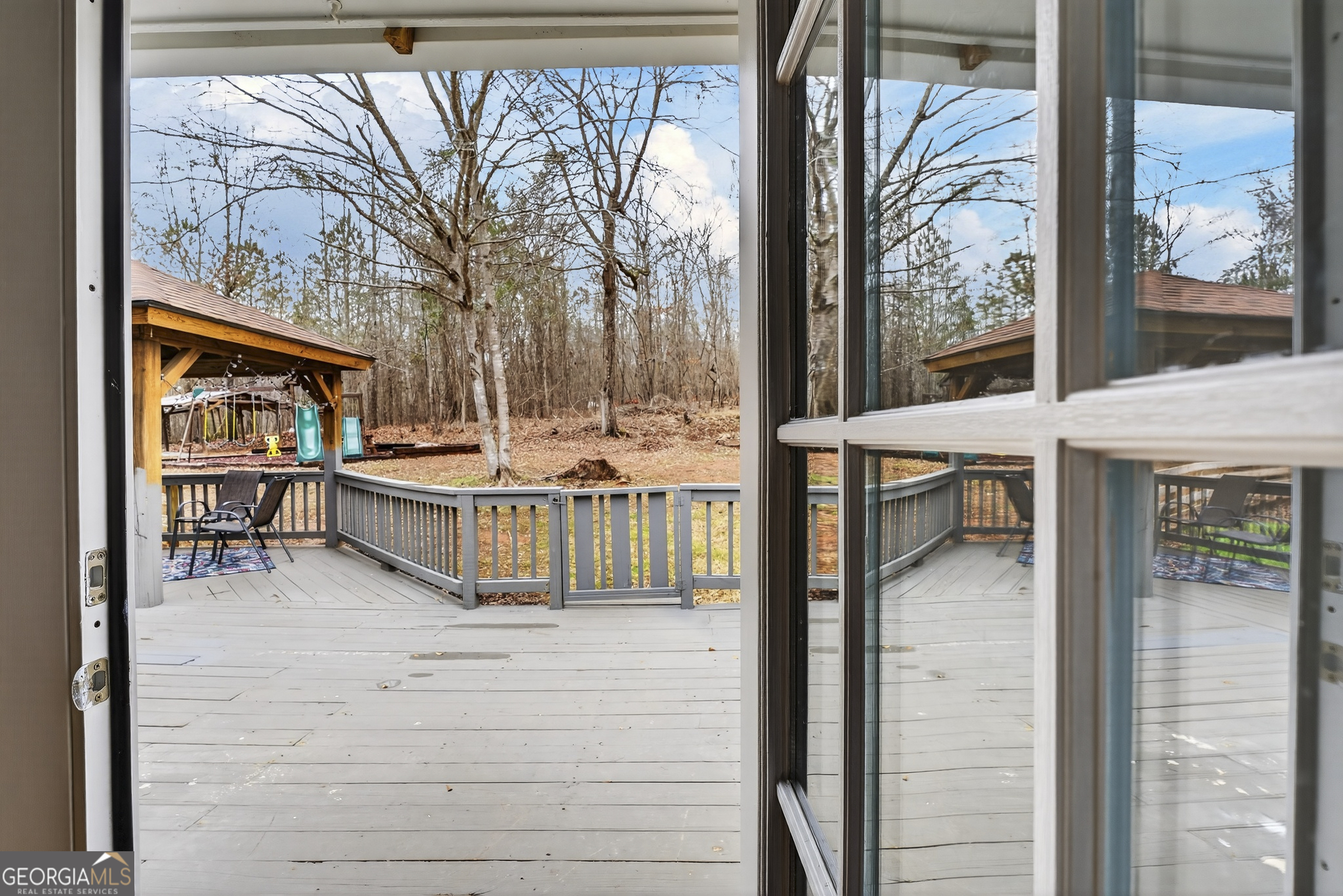 149 Forest Hill Road Southwest Milledgeville, GA 31061 - Photo 19 of 29 a living room with a large window and furniture
