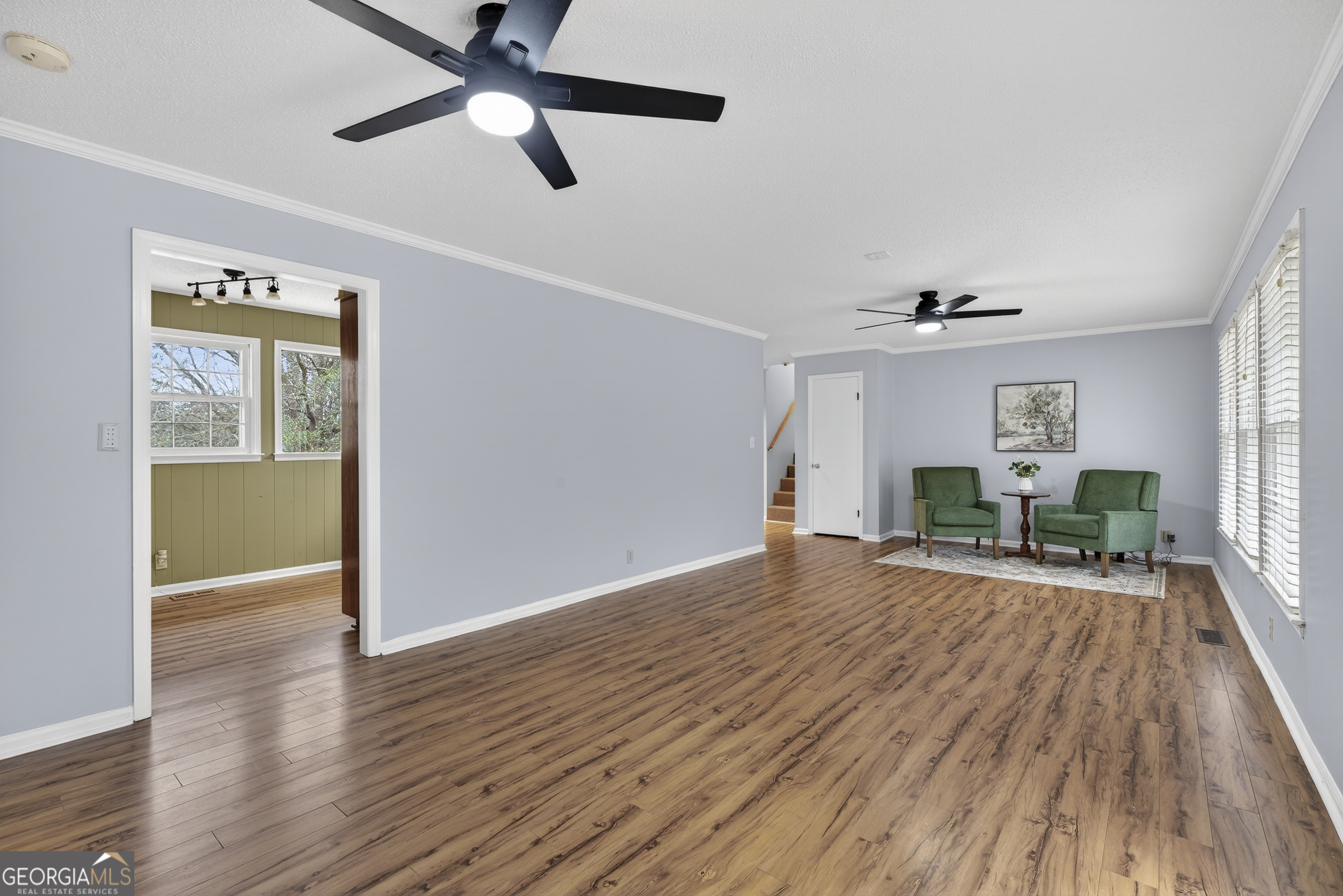 149 Forest Hill Road Southwest Milledgeville, GA 31061 - Photo 5 of 29 a view of empty room with wooden floor and fan