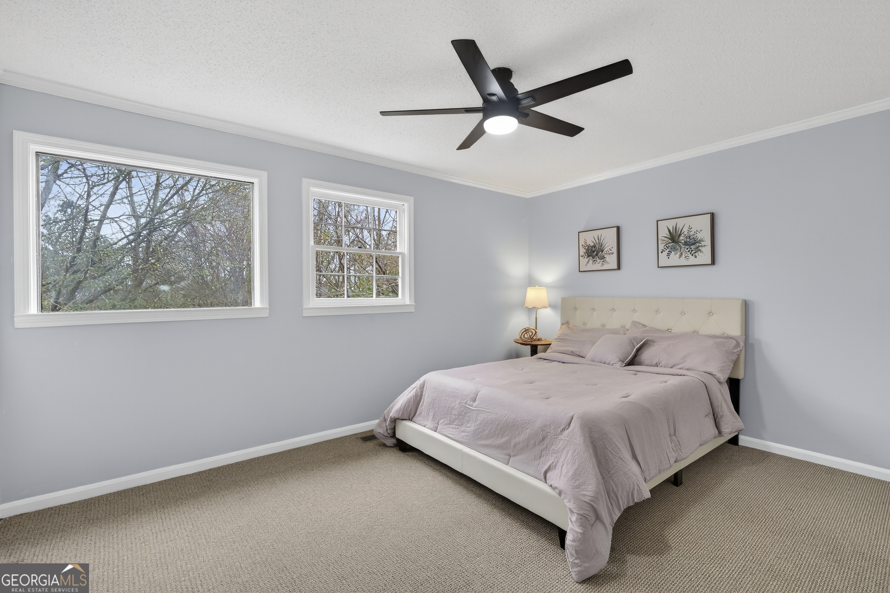 149 Forest Hill Road Southwest Milledgeville, GA 31061 - Photo 9 of 29 a bedroom with a bed and window