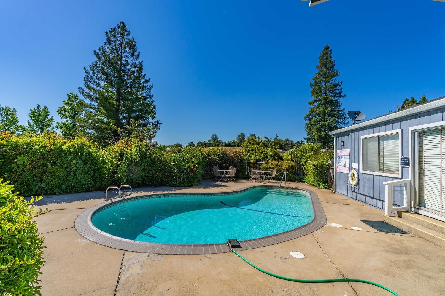 150 Clinton Road, Unit 38 Jackson, CA 95642 - Photo 18 of 18 a view of a swimming pool with a yard