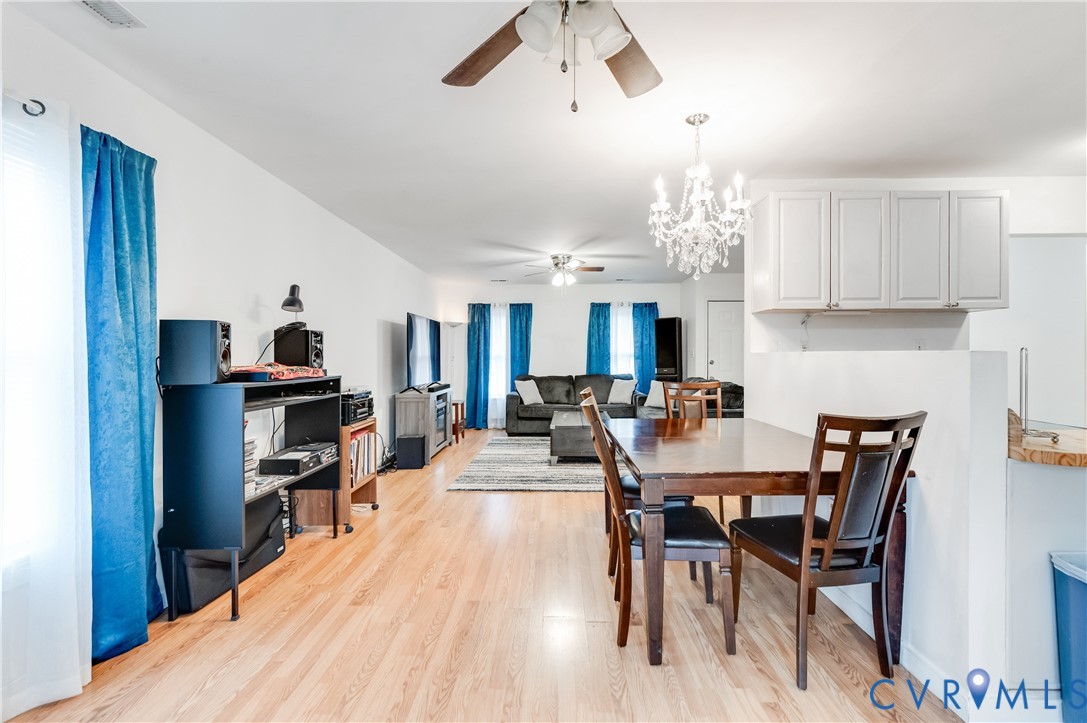 5724 Linda Road Sandston, VA 23150 - Photo 14 of 35 a view of a dining room with furniture and a chandelier