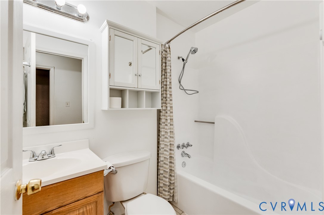 5724 Linda Road Sandston, VA 23150 - Photo 19 of 35 a bathroom with a sink a toilet and shower