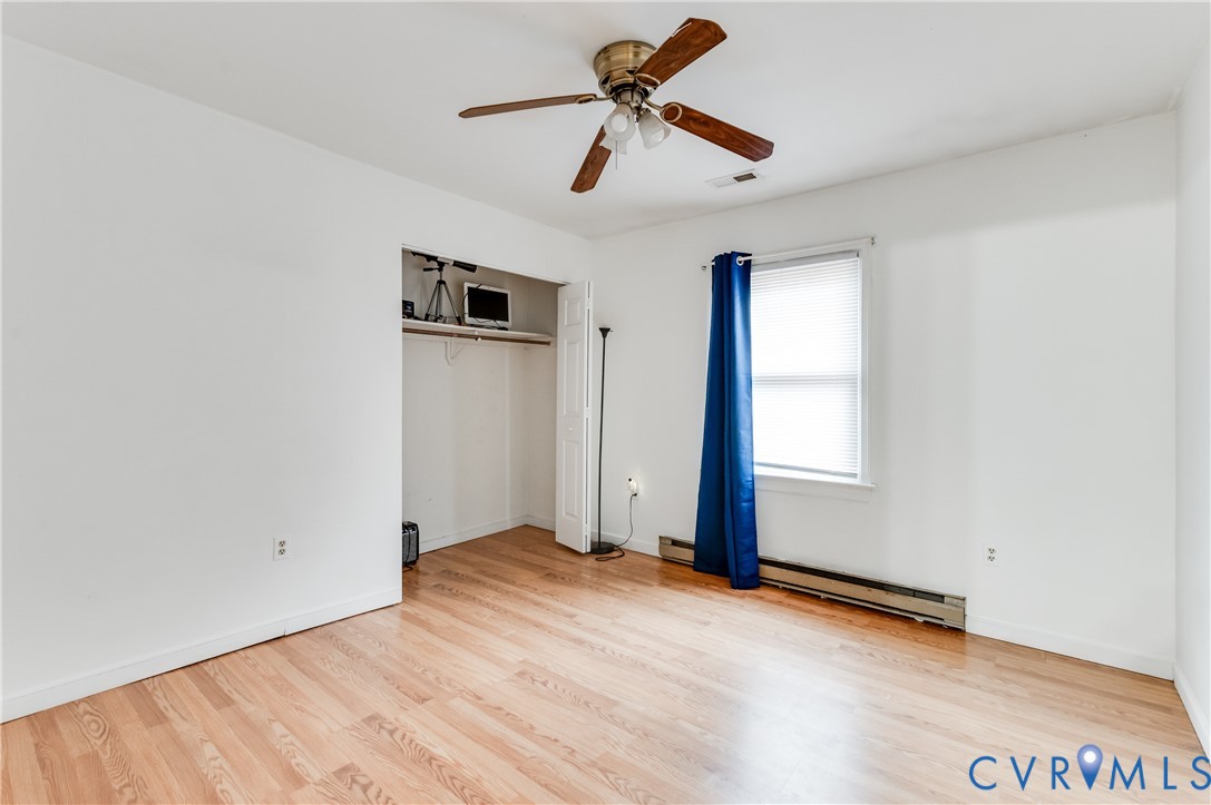 5724 Linda Road Sandston, VA 23150 - Photo 20 of 35 a view of empty room with wooden floor and ceiling fan