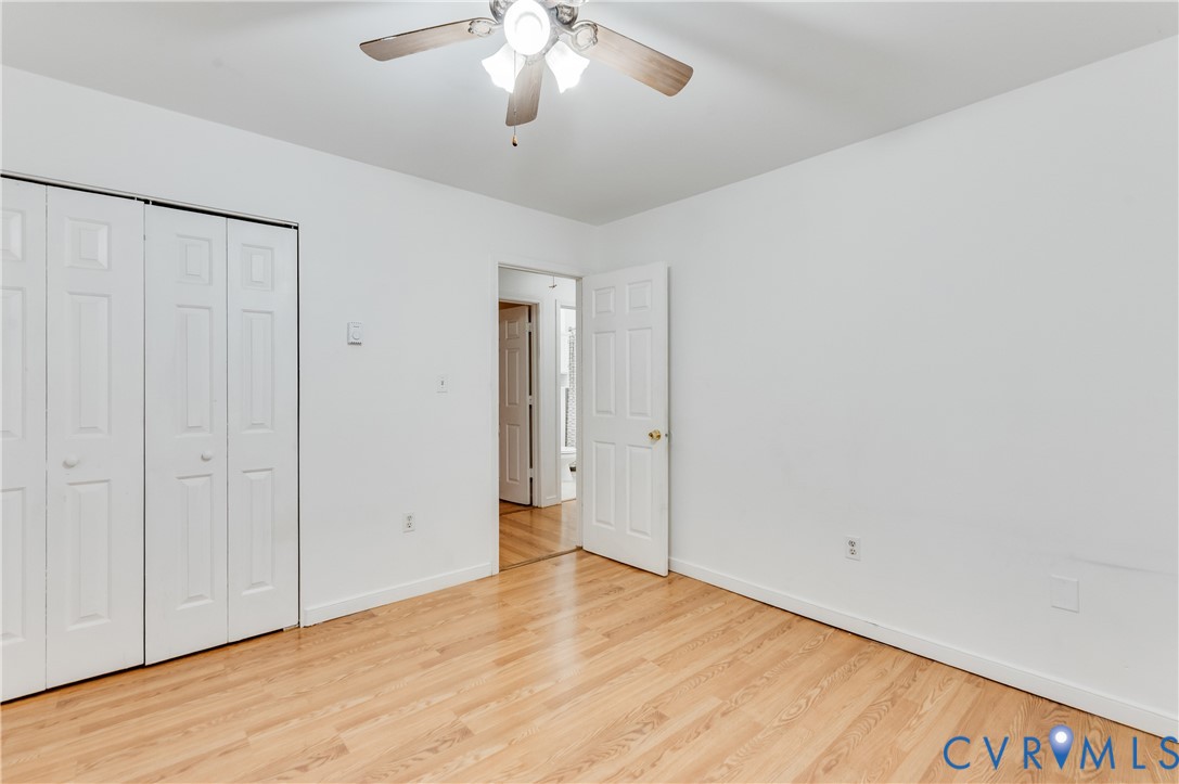 5724 Linda Road Sandston, VA 23150 - Photo 23 of 35 an empty room with wooden floor and windows