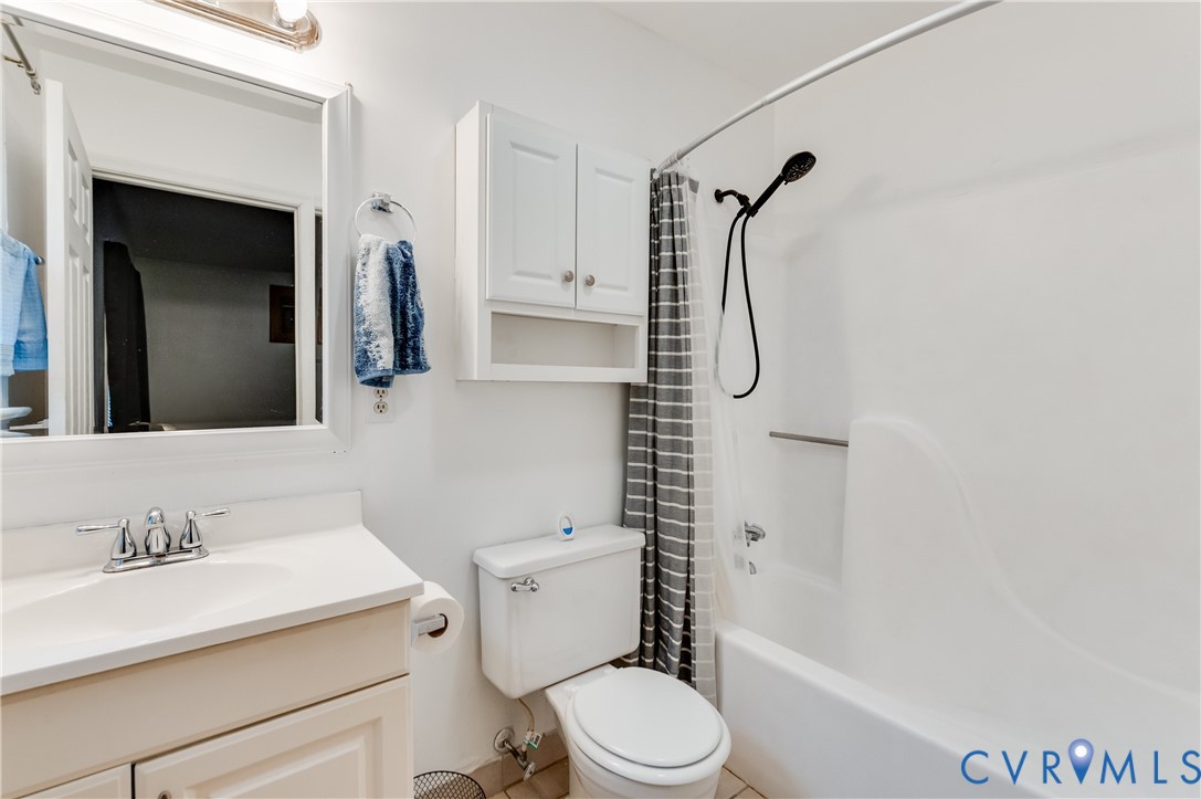5724 Linda Road Sandston, VA 23150 - Photo 26 of 35 a bathroom with a granite countertop sink toilet and shower