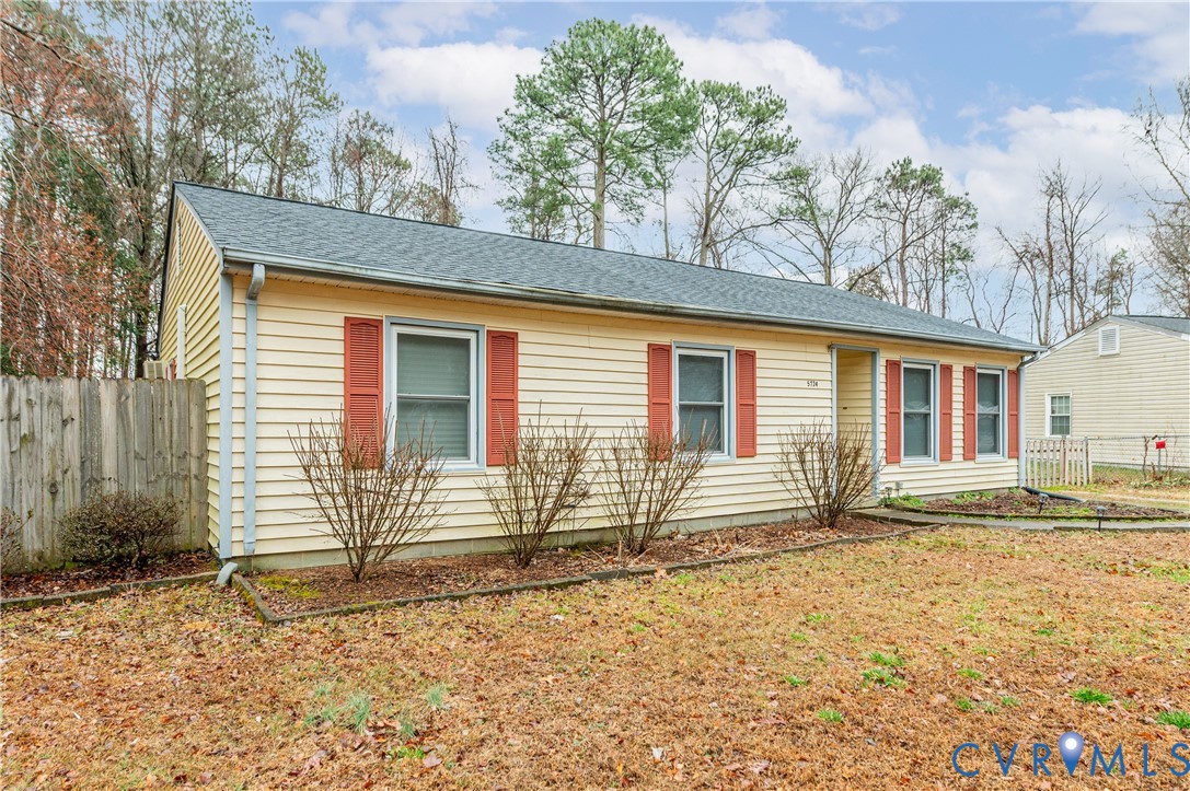 5724 Linda Road Sandston, VA 23150 - Photo 4 of 35 front view of a house with a bench