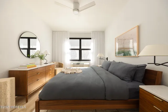 a bedroom with a large bed and a window