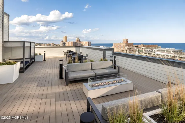 a view of roof deck with patio