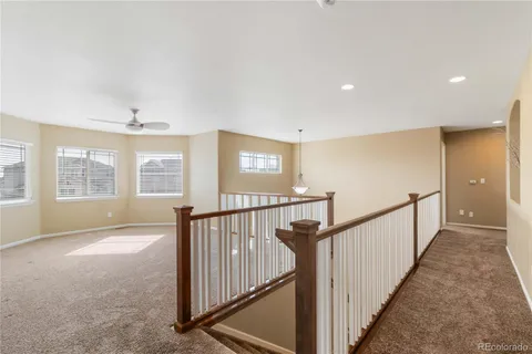 a view of a hallway with windows