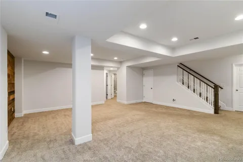 a view of an empty room with stairs