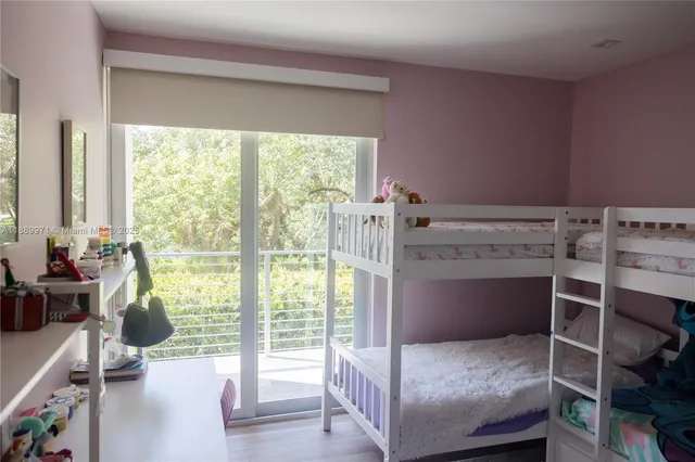 a bedroom with a bed and a desk