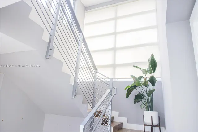 a view of balcony with wooden floor