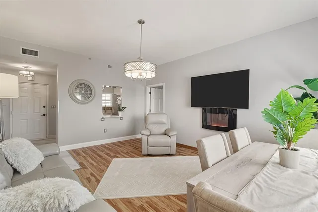 a bedroom with a large bed and a flat screen tv