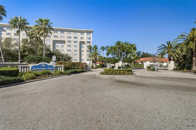 an aerial view of residential houses with city view