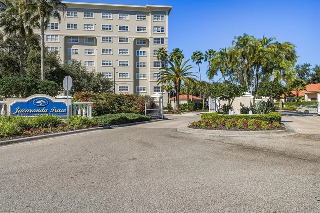 an aerial view of residential houses with city view