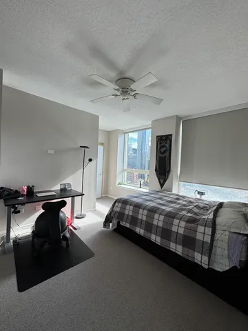 a bed room with furniture and a chandelier