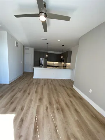 an empty room with a empty space and windows