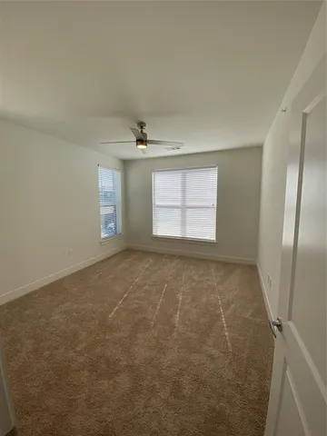 a spacious bathroom with a granite countertop sink and a mirror
