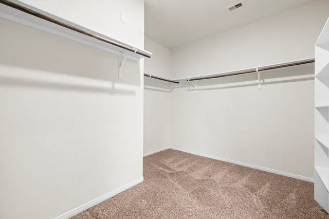 a view of a house with a yard and a porch