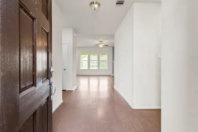 a view of hallway with natural light