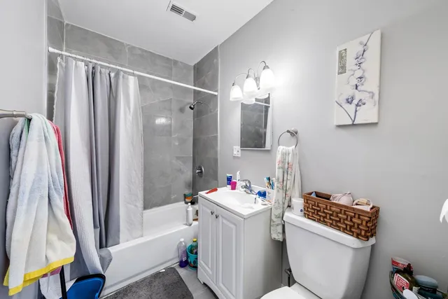 a front view of house with a garden