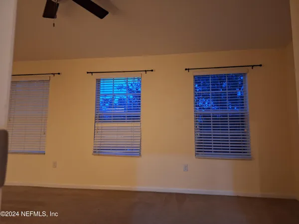 a view of that has a chair and a window