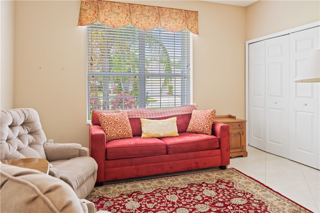 412 North Tangerine Square Southwest Vero Beach, FL 32968 - Photo 20 of 35 a living room with furniture and a window