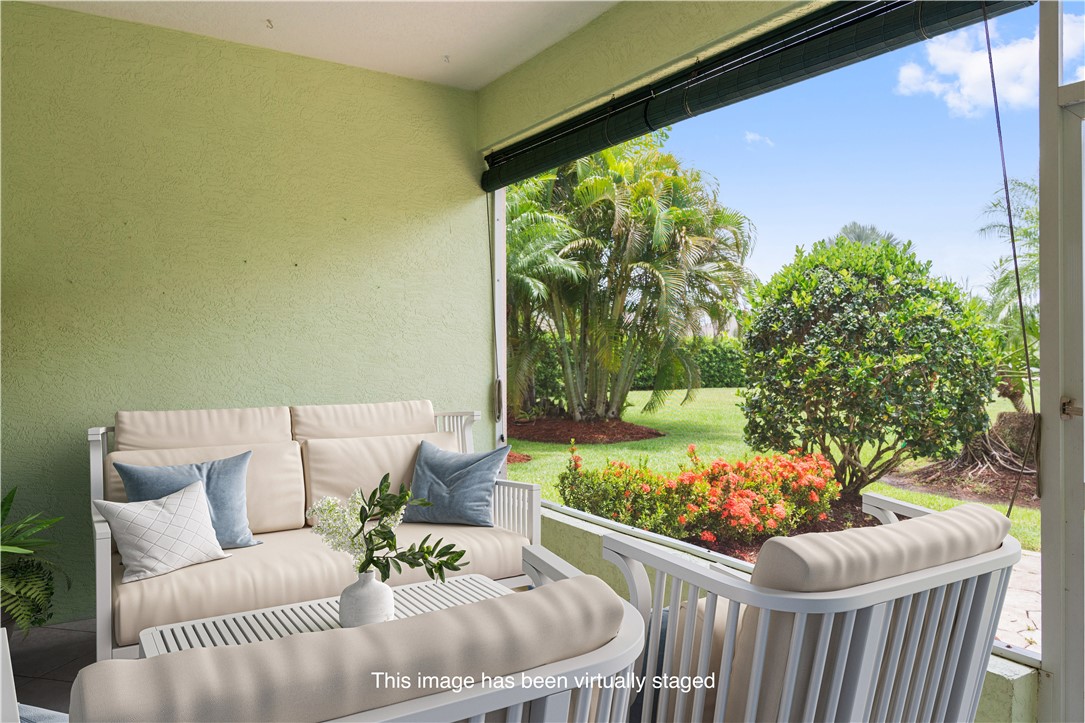 412 North Tangerine Square Southwest Vero Beach, FL 32968 - Photo 21 of 35 a outdoor living room with furniture