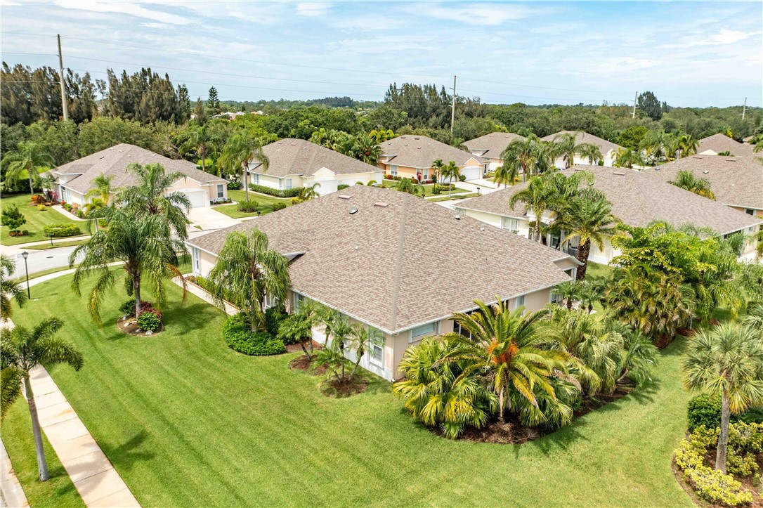 412 North Tangerine Square Southwest Vero Beach, FL 32968 - Photo 27 of 35 a view of a garden with an outdoor space