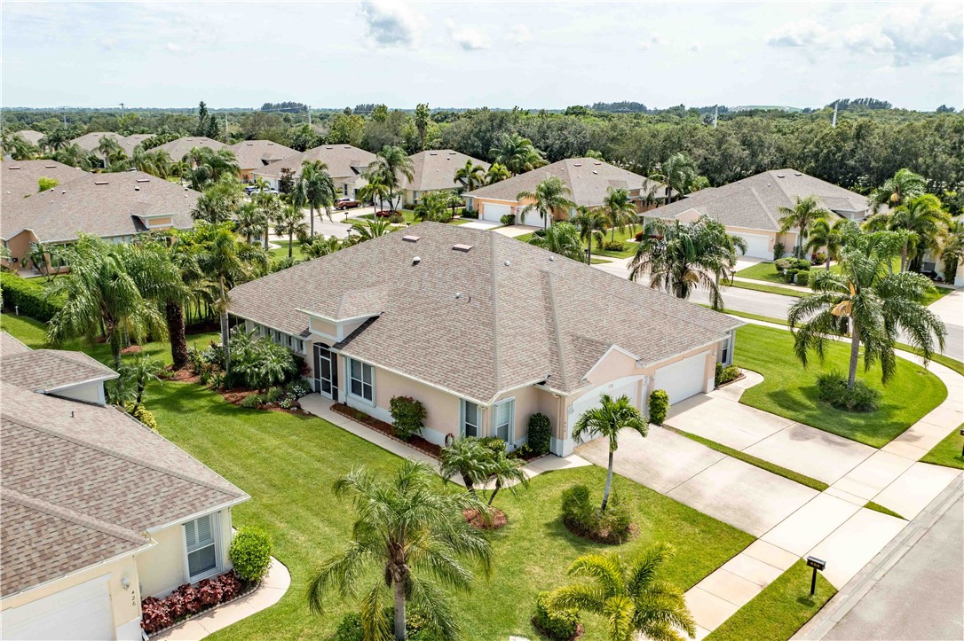412 North Tangerine Square Southwest Vero Beach, FL 32968 - Photo 28 of 35 an aerial view of a house with swimming pool and mountains