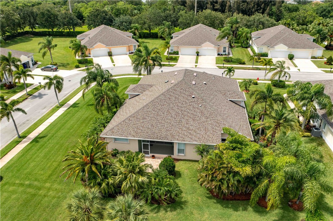 412 North Tangerine Square Southwest Vero Beach, FL 32968 - Photo 29 of 35 an aerial view of a house with a garden and lake view