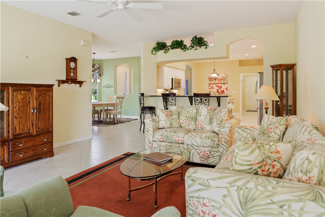 412 North Tangerine Square Southwest Vero Beach, FL 32968 - Photo 5 of 35 a living room with furniture and wooden floor