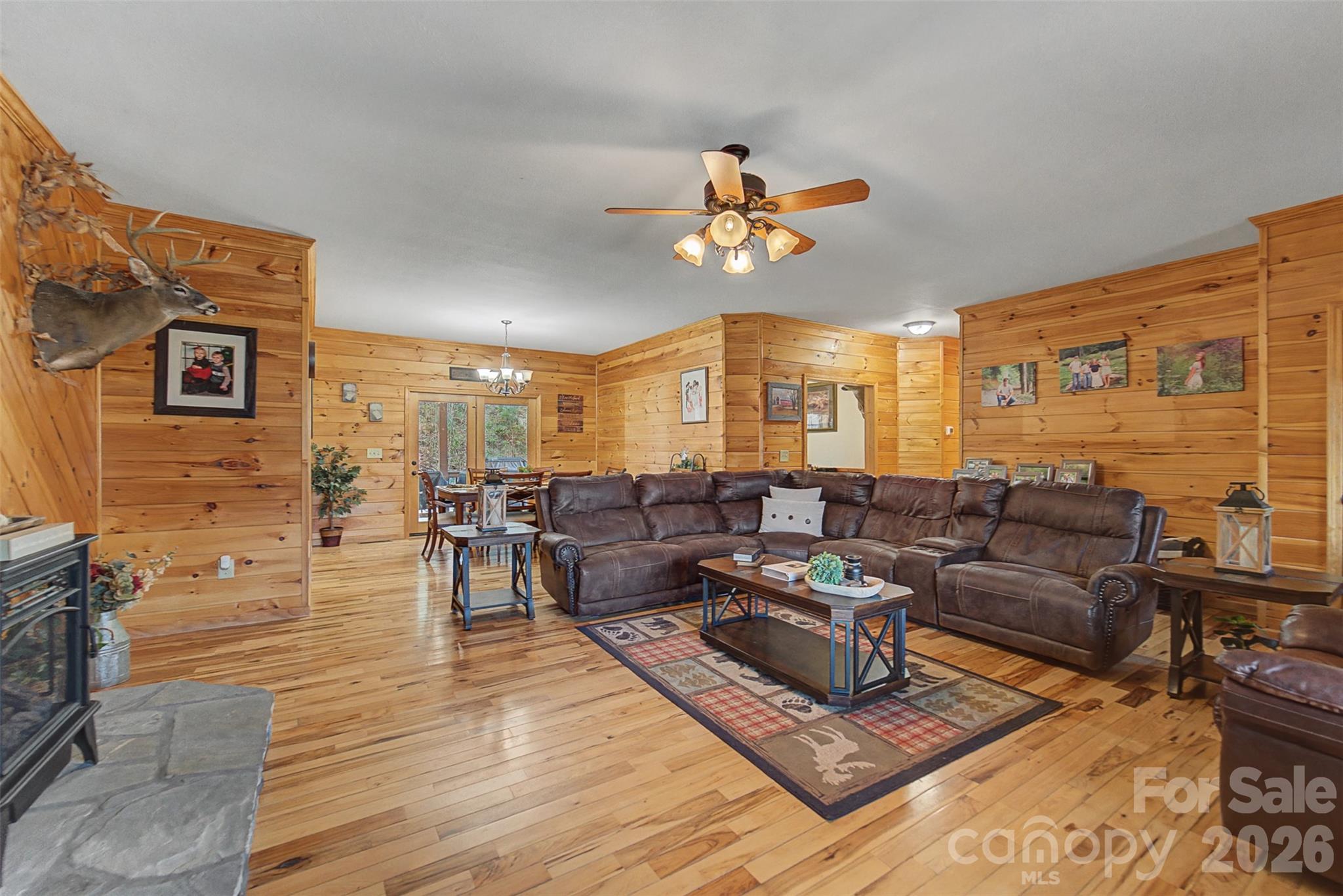 1960 Atoah Road Robbinsville, NC 28771 - Photo 11 of 48 a living room with furniture kitchen view and a chandelier