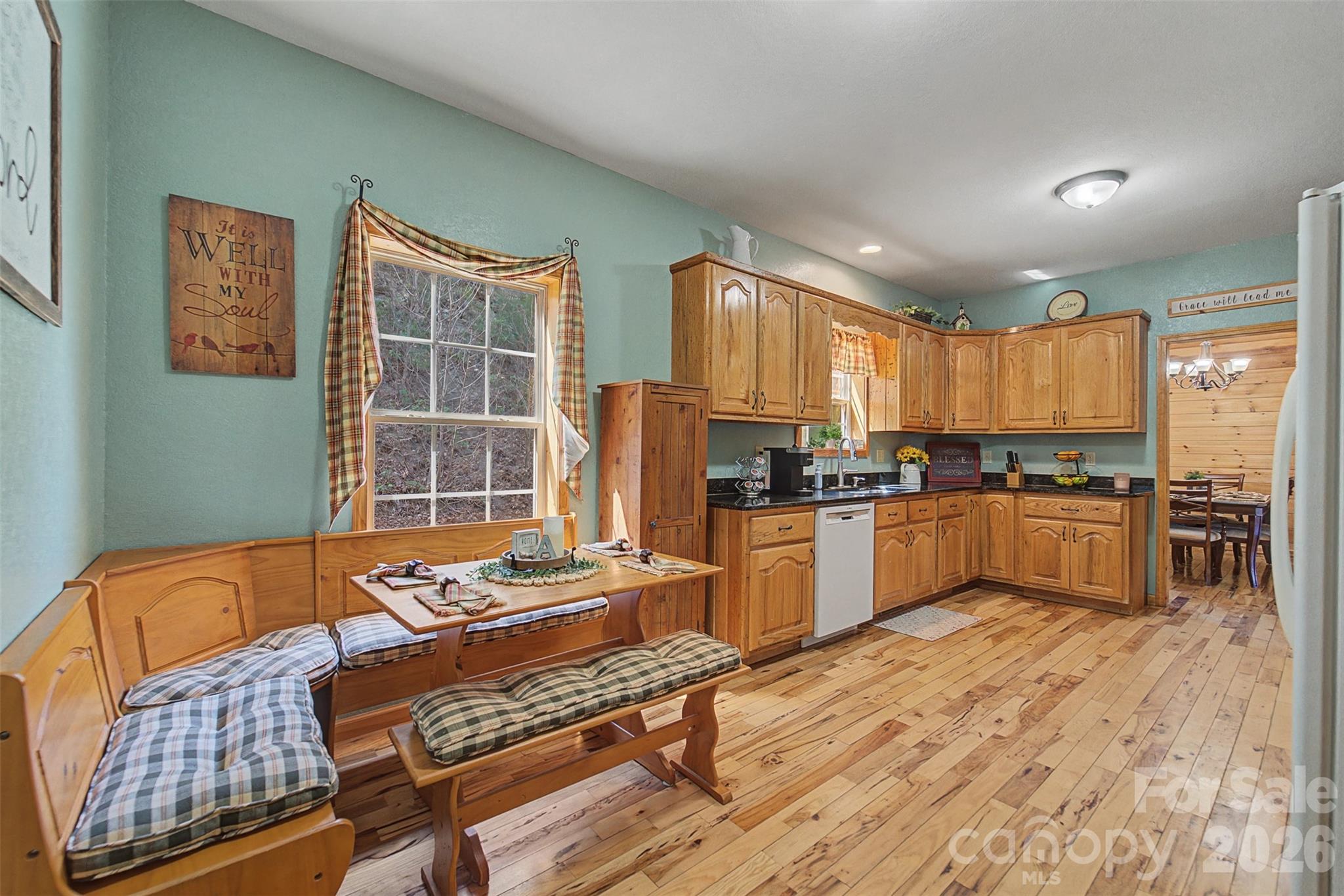 1960 Atoah Road Robbinsville, NC 28771 - Photo 19 of 48 a kitchen with granite countertop lots of counter top space and stainless steel appliances