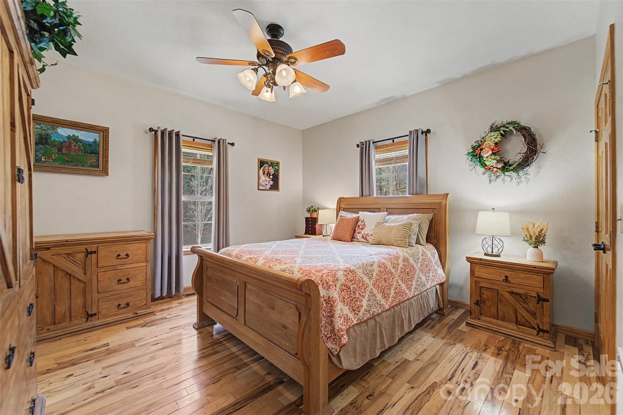 1960 Atoah Road Robbinsville, NC 28771 - Photo 23 of 48 a bedroom with a bed and a chandelier
