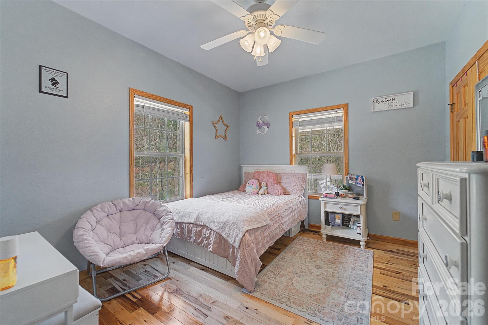1960 Atoah Road Robbinsville, NC 28771 - Photo 28 of 48 a bedroom with a bed and a chandelier