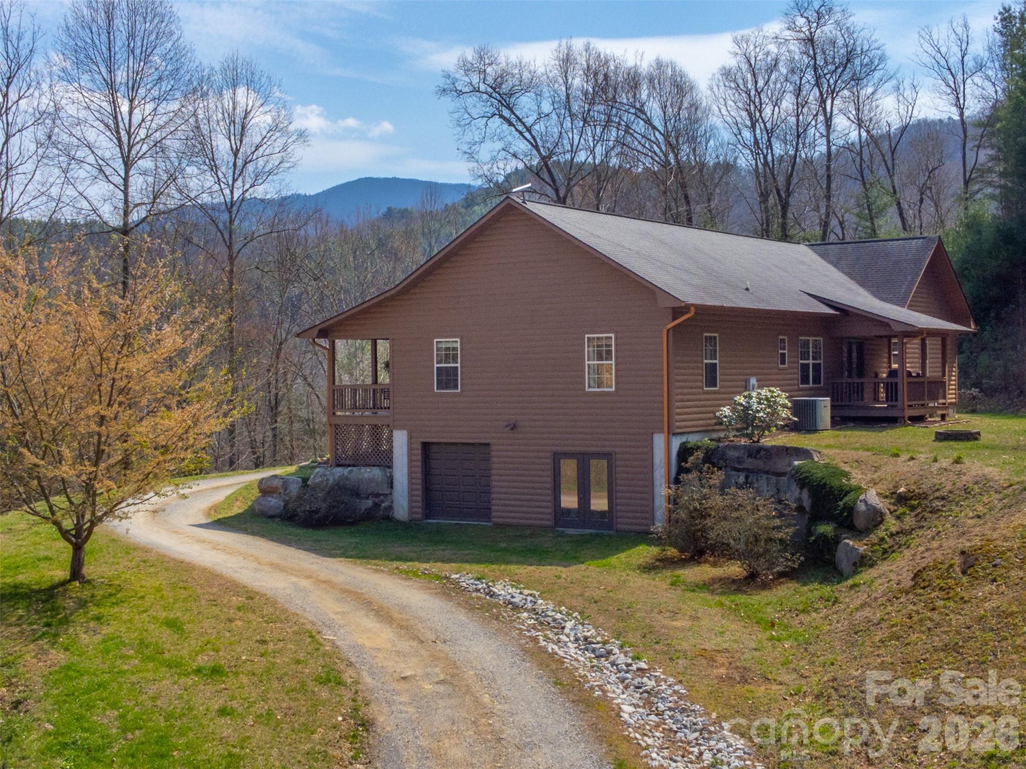 1960 Atoah Road Robbinsville, NC 28771 - Photo 3 of 48 a front view of a house with a yard
