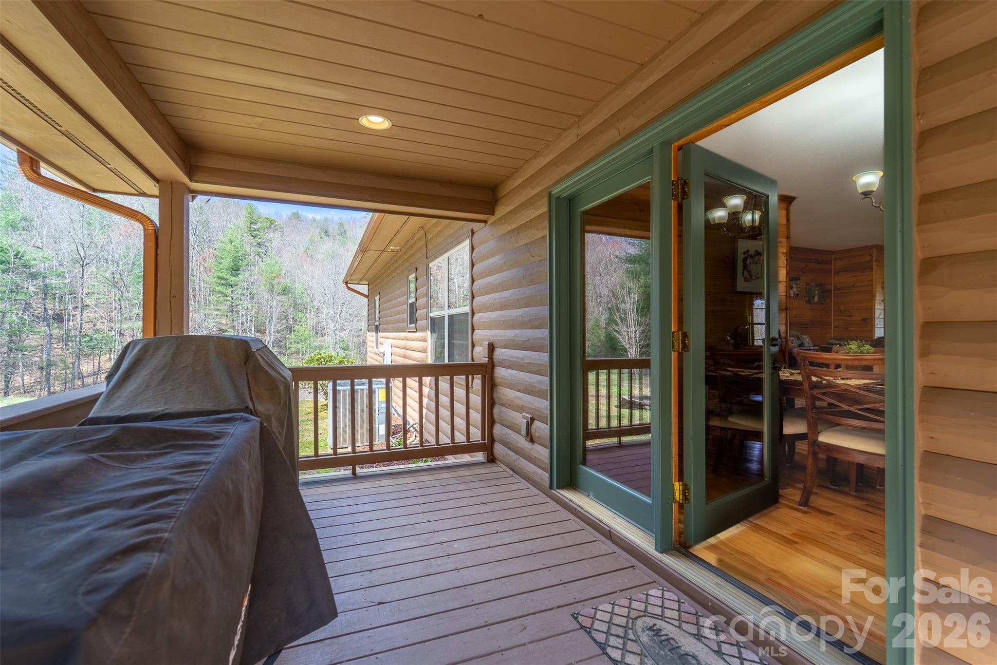 1960 Atoah Road Robbinsville, NC 28771 - Photo 37 of 48 a view of a balcony with wooden floor and floor to ceiling window