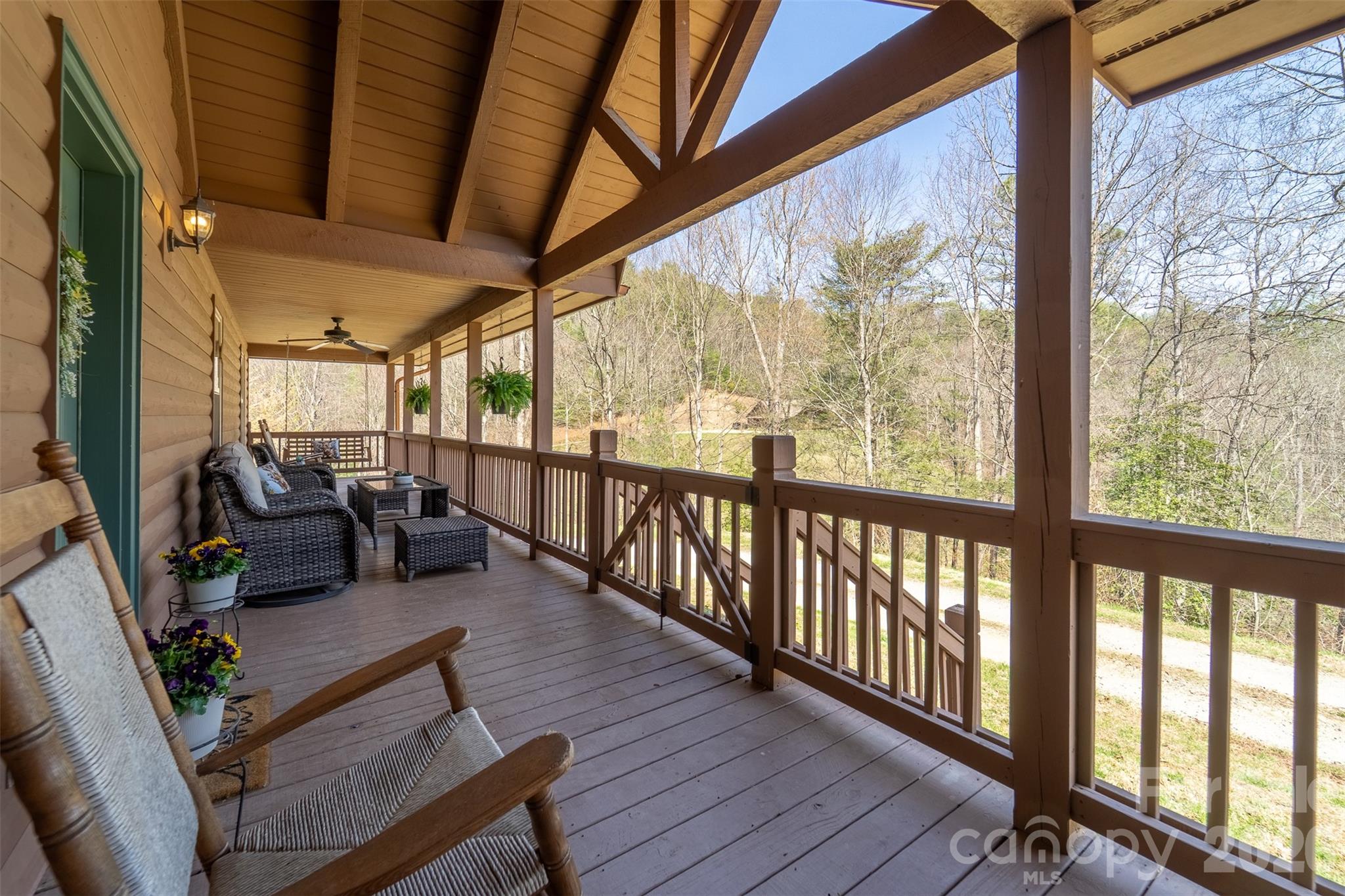 1960 Atoah Road Robbinsville, NC 28771 - Photo 6 of 48 a living room with furniture a wooden floor and a large window