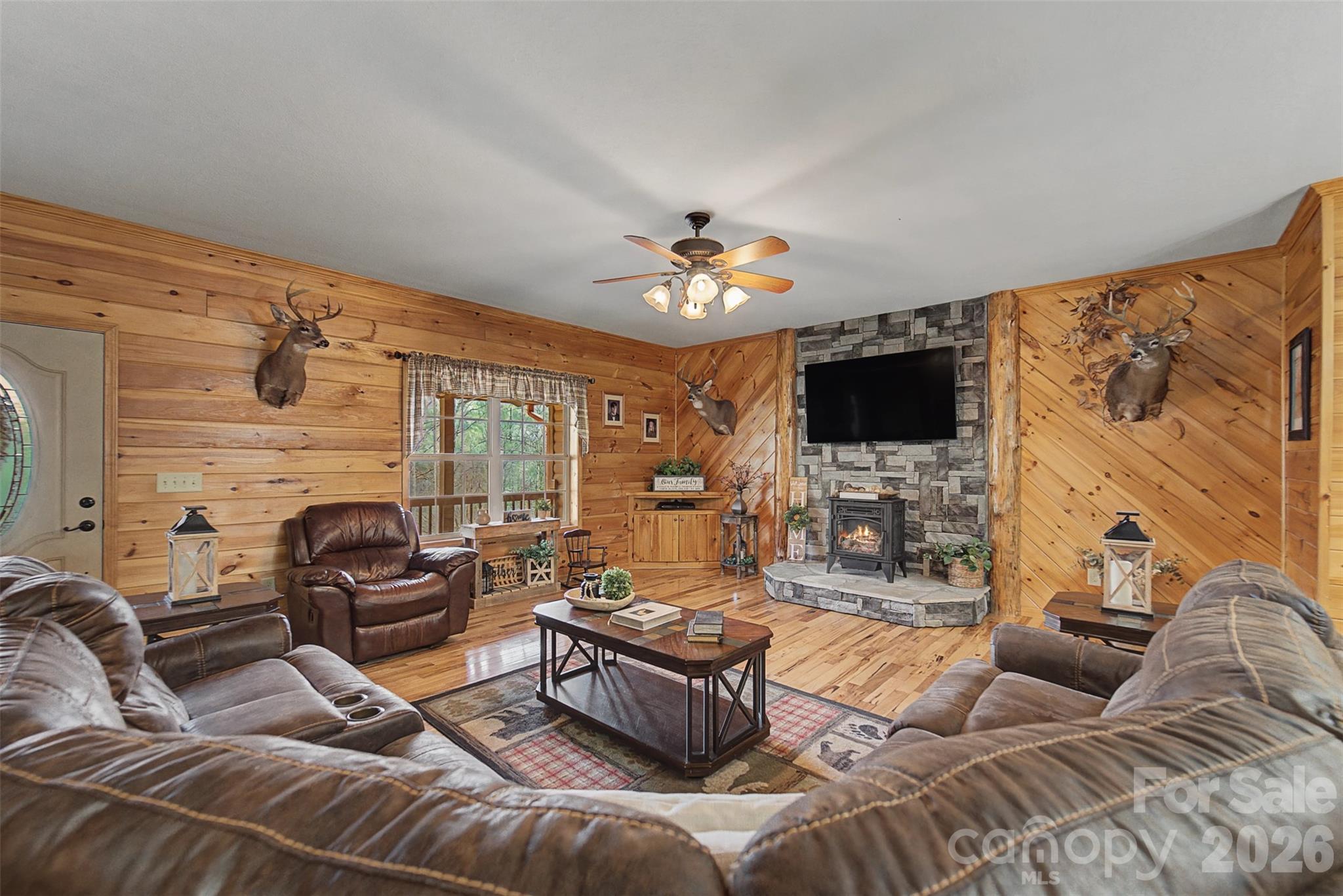 1960 Atoah Road Robbinsville, NC 28771 - Photo 9 of 48 a living room with furniture and a flat screen tv