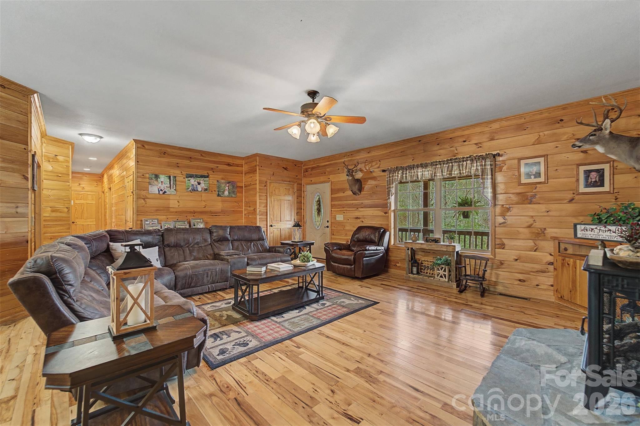 1960 Atoah Road Robbinsville, NC 28771 - Photo 10 of 48 a living room with furniture a fireplace and a flat screen tv